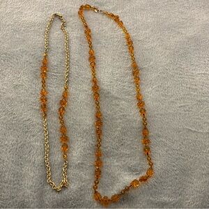 Comes with the two necklaces! In great condition.